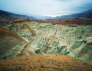 Breathtaking views of the grey-blue badlands and the John Day river valley from the Blue Basin Overlook Trail at the John Day Fossil Beds in Kimberly Oregon