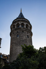 Fototapeta na wymiar Istanbul, Turkey: the Galata Tower, a medieval stone tower built by Genoese in 1348 in the Karakoy quarter, a cone-capped cylinder dominating the skyline and offering panoramic vista of the city