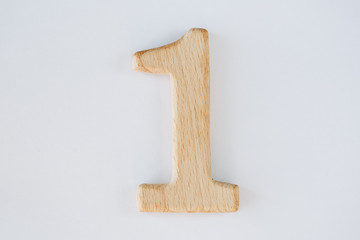 wooden figure number one isolated on white background