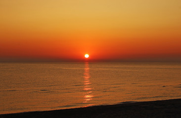Orange sunrise on the beach