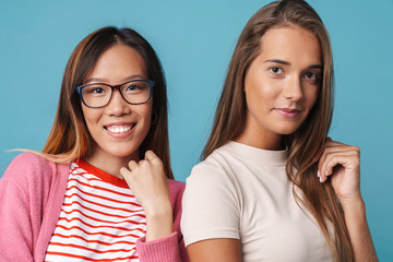 Portrait of multinational pretty women smiling and looking at camera