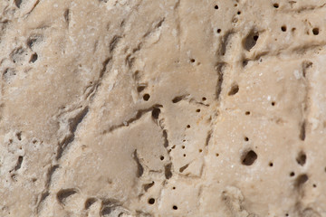 Stony beach by the sea, background of small stones, close up