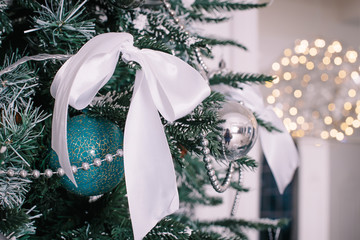 Closeup on Christmas tree decoration over festive background