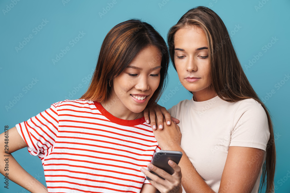 Wall mural portrait of multinational beautiful women using cellphone