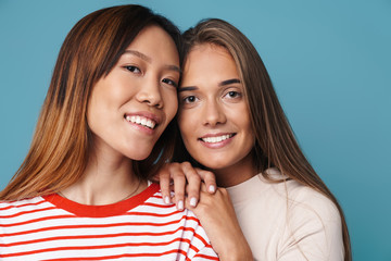 Portrait of multinational beautiful women smiling and looking at camera