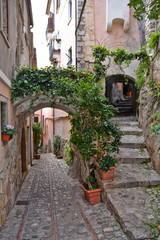 Fototapeta na wymiar Monte San Biagio, Italy, 03/24/2018. A street among the old houses of a village in the Lazio region.