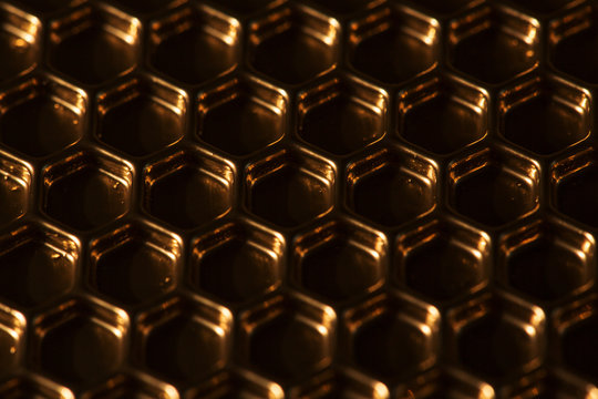 Abstract hexagon background. Hexagons industrial background. Golden bee honeycombs.