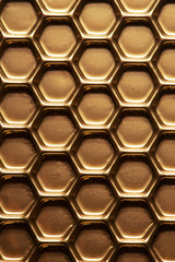 Abstract hexagon background. Hexagons industrial background. Golden bee honeycombs.