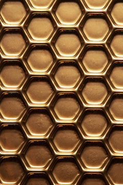 Abstract hexagon background. Hexagons industrial background. Golden bee honeycombs. © ninell