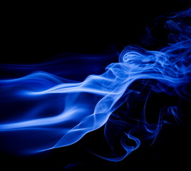 Blue smoke on black background