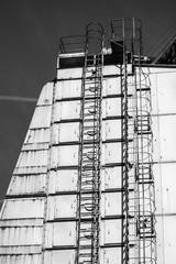Abstract black and white industrial background, part of a tall i