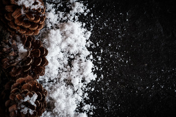 Pinecones with Snow on Black Background