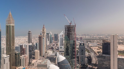 Fototapeta premium Skyline view of the buildings of Sheikh Zayed Road and DIFC aerial timelapse in Dubai, UAE.