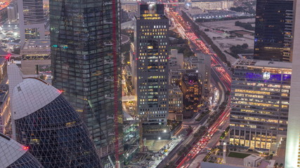 Skyline of the buildings of Sheikh Zayed Road and DIFC aerial day to night timelapse in Dubai, UAE.