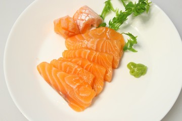 salmon sashimi on plate with Vegetable