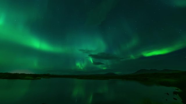 Aurora borealis reflecting in calm lake water Thingvellir Iceland.mov