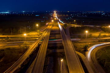 Fototapeta na wymiar aerial view ring road and interchange connecting the city at night