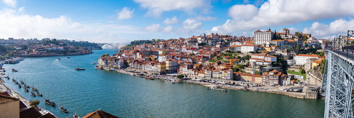 Panoramic view of the Douro River snaking through the city of Porto from the Ponte Luiz bridge with...