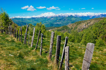 Fototapeta na wymiar Rural fence in the mountains on the Alps, Mottarone, Stresa, Italy