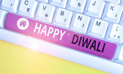 Writing note showing Happy Diwali. Business concept for festival of lights that celebrated by millions of Hindus White pc keyboard with note paper above the white background