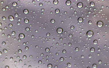 silver colored background with raindrops
