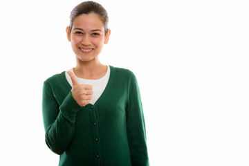 Studio shot of happy young beautiful woman smiling and giving th