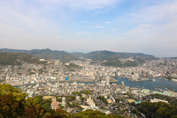 Fototapeta na wymiar Landscape view of top Mount Inasa in sunny day with Nagasaki city and blue sky and mountain