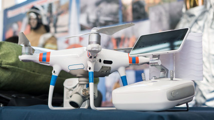 Drone with remote control. Professional quadcopter for making aerial photo at emergency services show