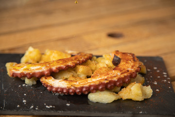 Octopus with paprika, potatoes and olive oil is a typical tapa from Galicia, Spain