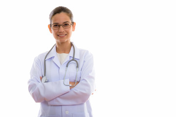 Fototapeta premium Studio shot of young happy woman doctor smiling while wearing ey