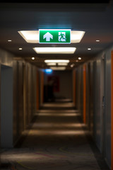 Sign : Emergency exit sign at path way indoor building public facility that emergency escape route...