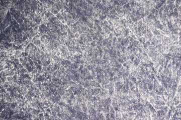 Texture of a gray stone-washed denim fabric