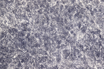 Texture of a gray stone-washed denim fabric