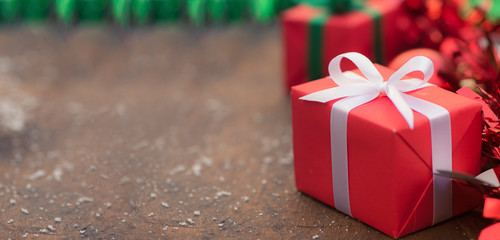 Gift boxes with a white bow against a background bokeh of twinkling  Luxury New Year gift Christmas...