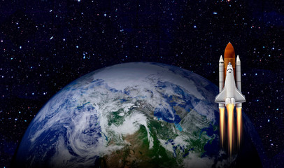 Space shuttle launch in the open space over the Earth. Elements of this image furnished by NASA