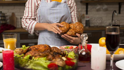 Woman holding bread and turkey close-up