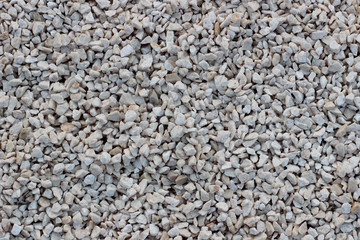 White small pebble on sea beach. Background.