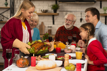 Family generations ready to eat on thanksgiving table