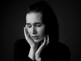 Portrait of sad young woman. Close up. Black and white