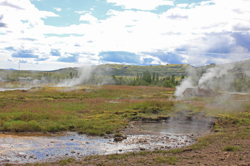 strokkur volcano on a sunny day in iceland