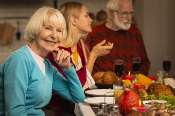 Daughter and father chatting and mother looking at camera