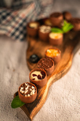 chocolates with different toppings and with mint and berries