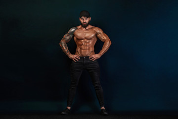 Strong and fit man bodybuilder. Sporty muscular guy athlete. Sport and fitness concept. Men's...