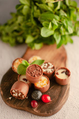 chocolates with different toppings and with mint and berries