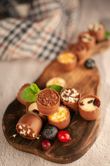 chocolates with different toppings and with mint and berries