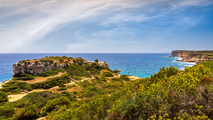Fototapeta na wymiar Panorama of beautiful beach and bay with turquoise sea water, Cala des Moro, Santanyi, Mallorca island, Spain