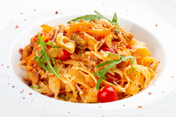Duck fettuccine with cherry tomatoes in red sauce