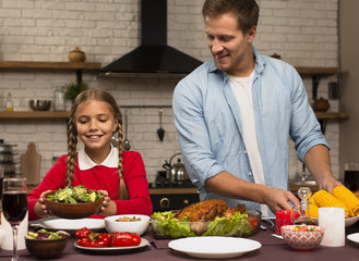 Father and daughter preparing the meal