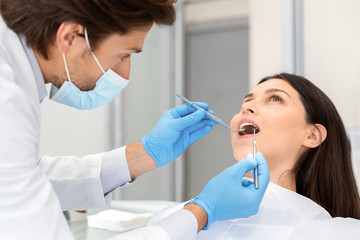 Young woman making check up in dental clinic