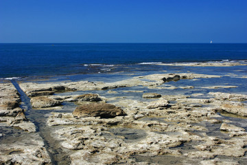 Rocky coast of the blue sea